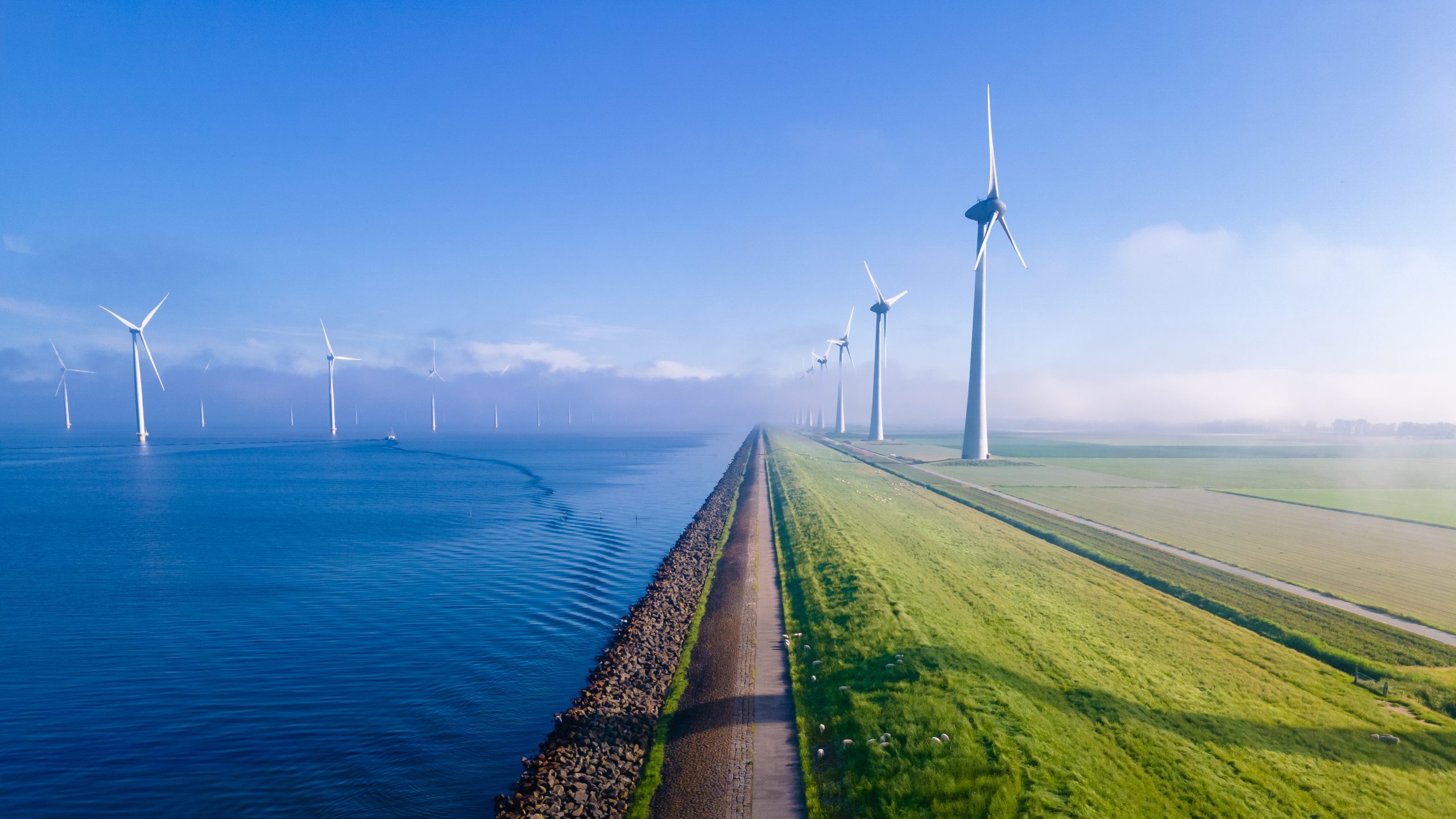 Offshore,Windmill,Park,With,Clouds,And,A,Blue,Sky,,Windmill